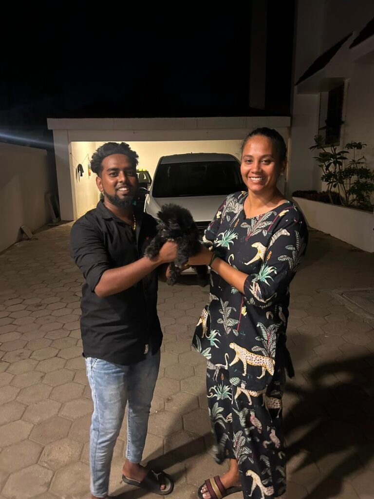 happy customer with toy poodle puppy from Kumaran Pet House Chennai